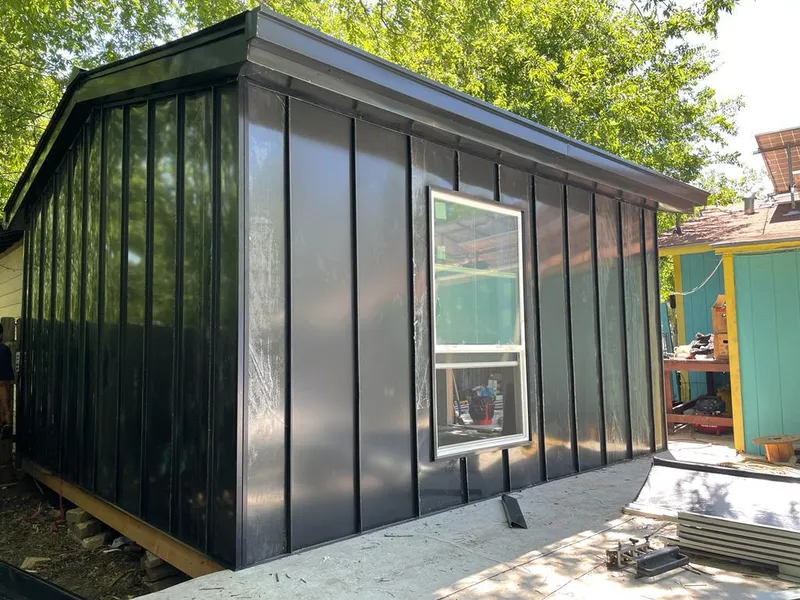 Black standing seam metal wall panels for Roof Inspection in Aztec