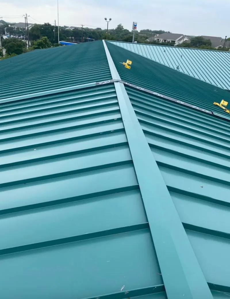 Green commercial metal roof ridge and valley for Metal Roof Repair in Aztec